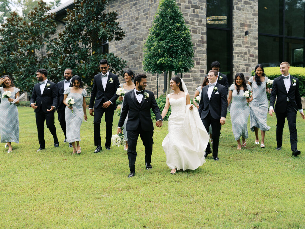 candid bridal party photos walking toward the camera