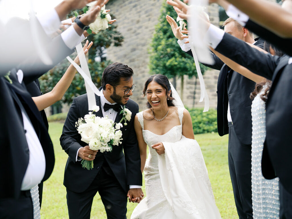 bridal party tunnel photo with the bride and groom