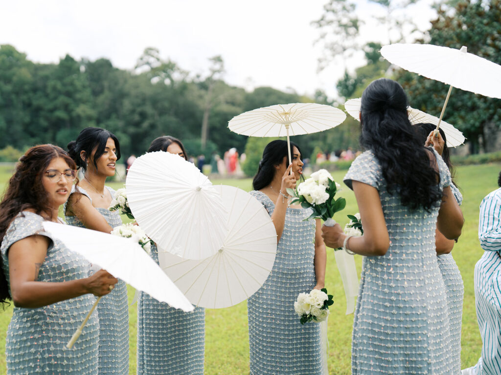 bridesmaids holding umbrellas
