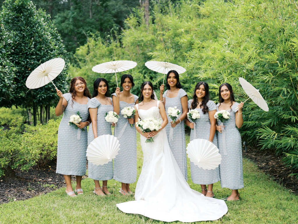 bridesmaids holding umbrellas