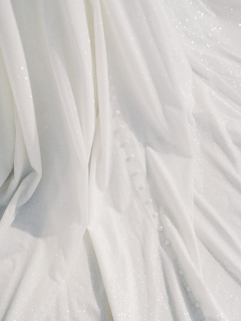 wedding detail photos of the bride in her dress