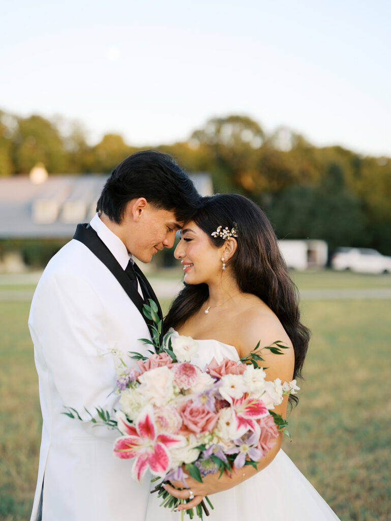 bride and groom portraits at the windrow events in a field