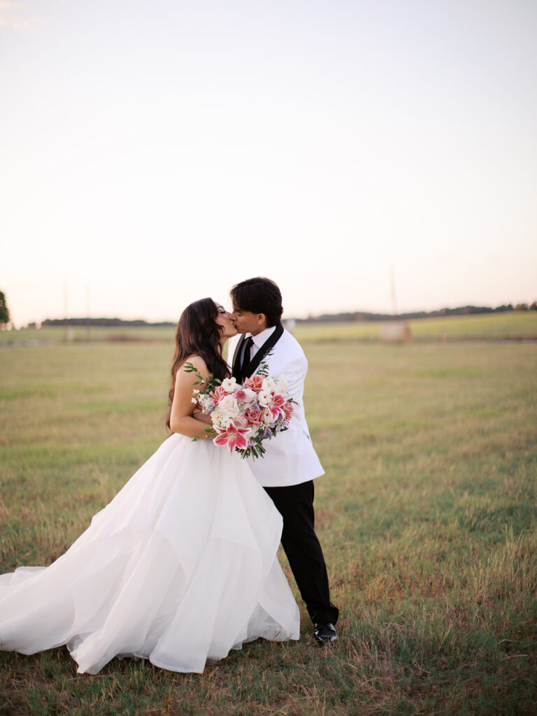 bride and groom portraits at the windrow events in a field