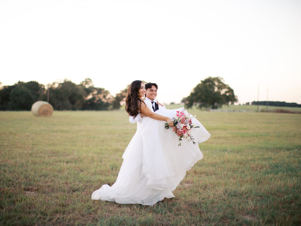 bride and groom portraits at the windrow events in a field