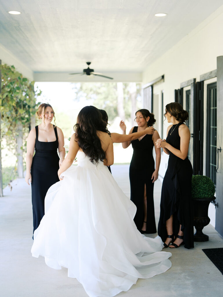 documentary style wedding photos of bride with her bridesmaids