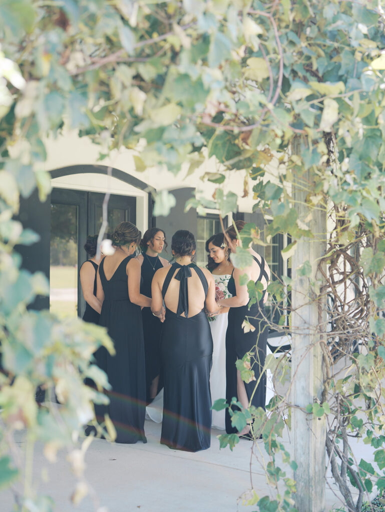 documentary style wedding photos of bride with her bridesmaids