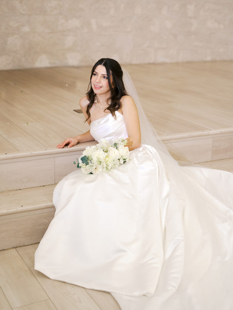 bride and groom poses indoor wedding venue in houston