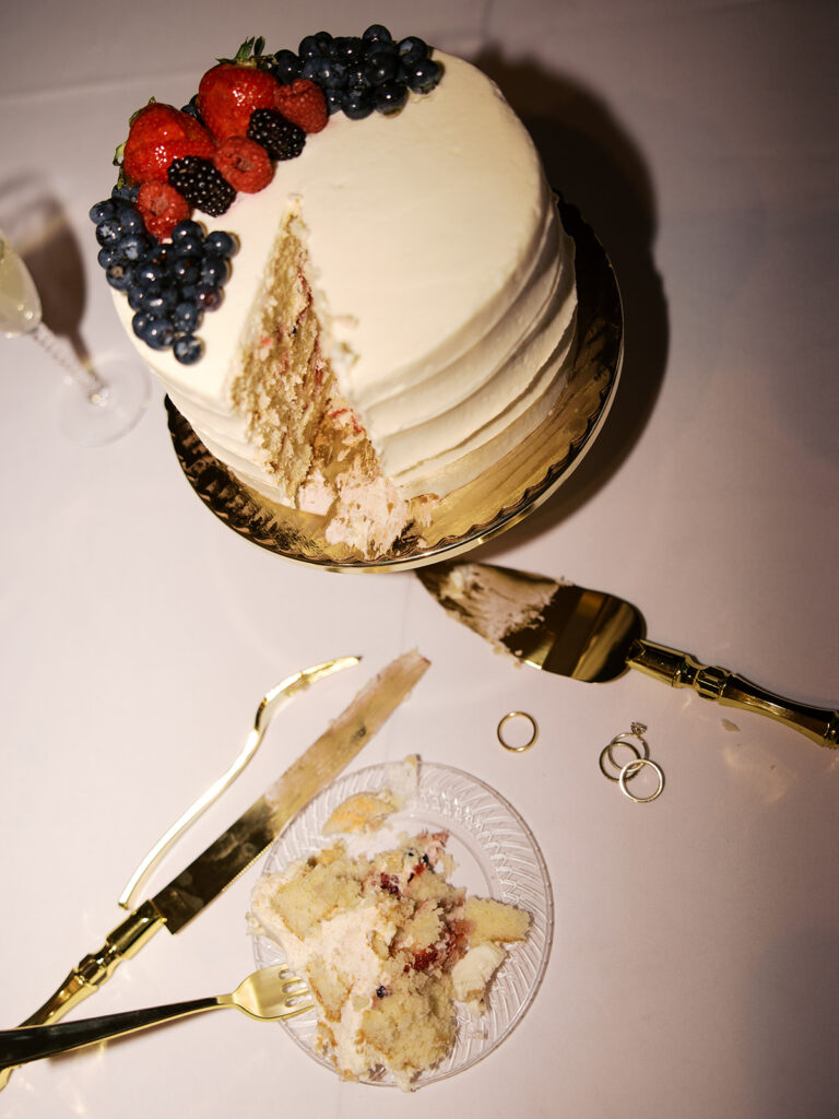 bride and groom cutting the cake vintage wedding cake photos at Villa Antonia Austin