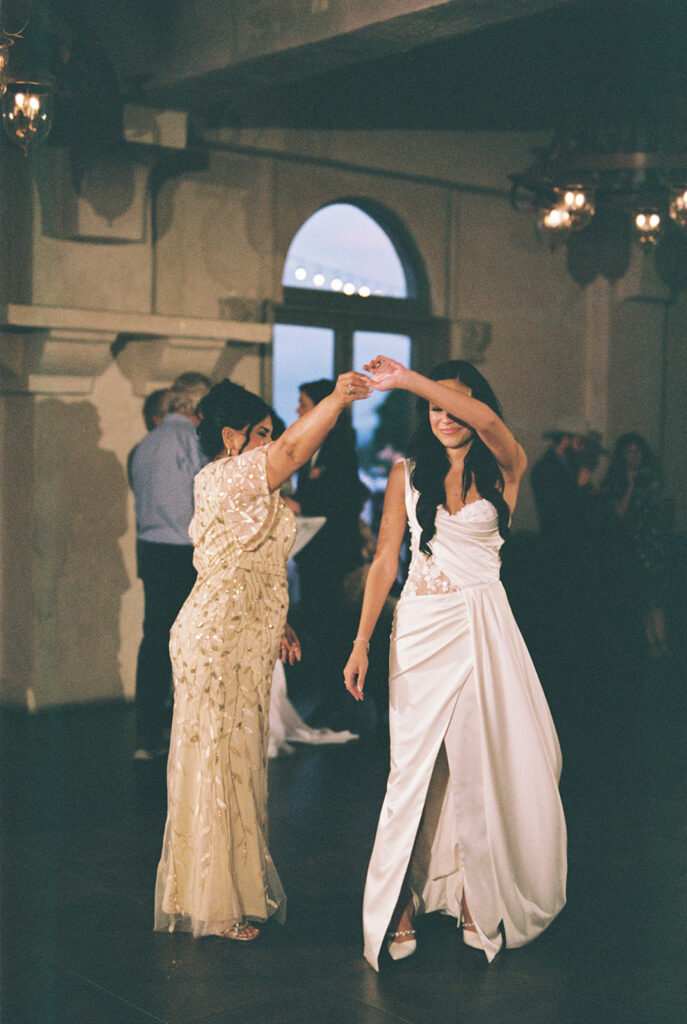 mom and daughter first dance with bride on film at Villa Antonia Austin