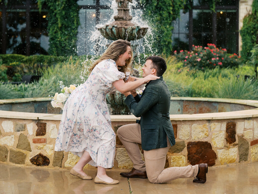 excited reaction to surprise proposal in the rain