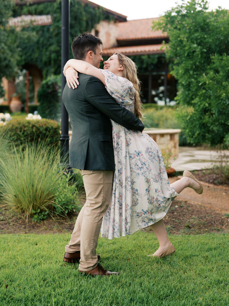 couple celebrating romantic surprise engagement in the rain
