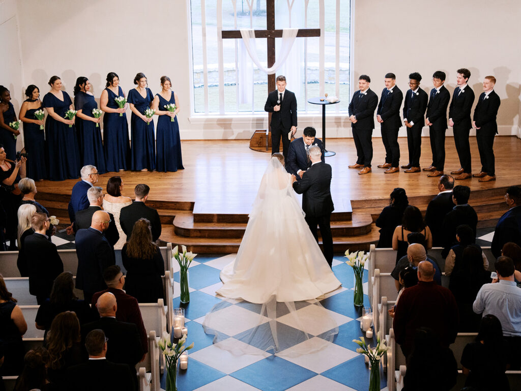 indoor wedding ceremony at the weinberg at wixon valley christ centered wedding day