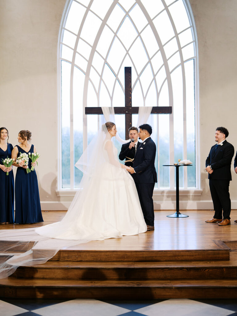indoor wedding ceremony at the weinberg at wixon valley christ centered wedding day