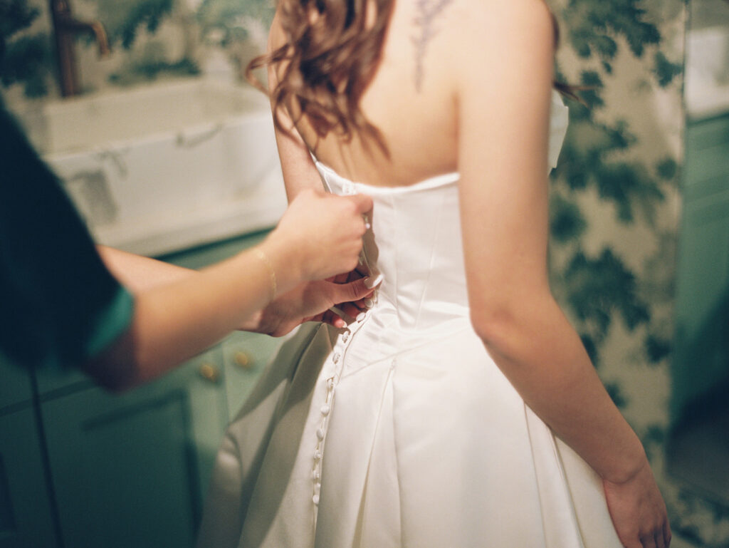 soft grainy film wedding photos of bride getting ready