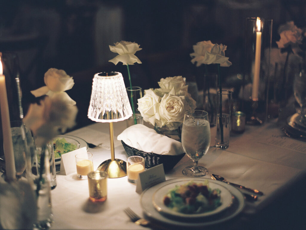 grainy film wedding photo of head table decor