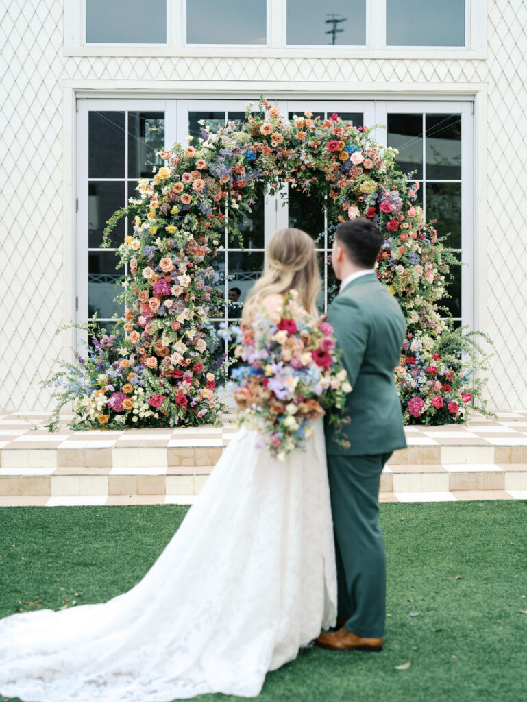 bride and groom admiring their florals 