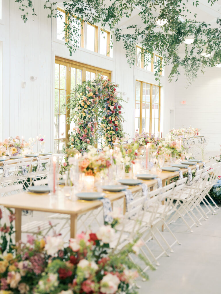 reception space and florals at wedding in austin spring wedding color palette spring wedding theme