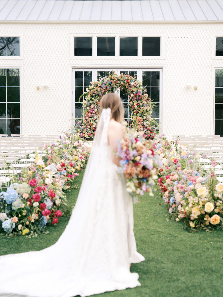 bride admiring florals on wedding day in austin