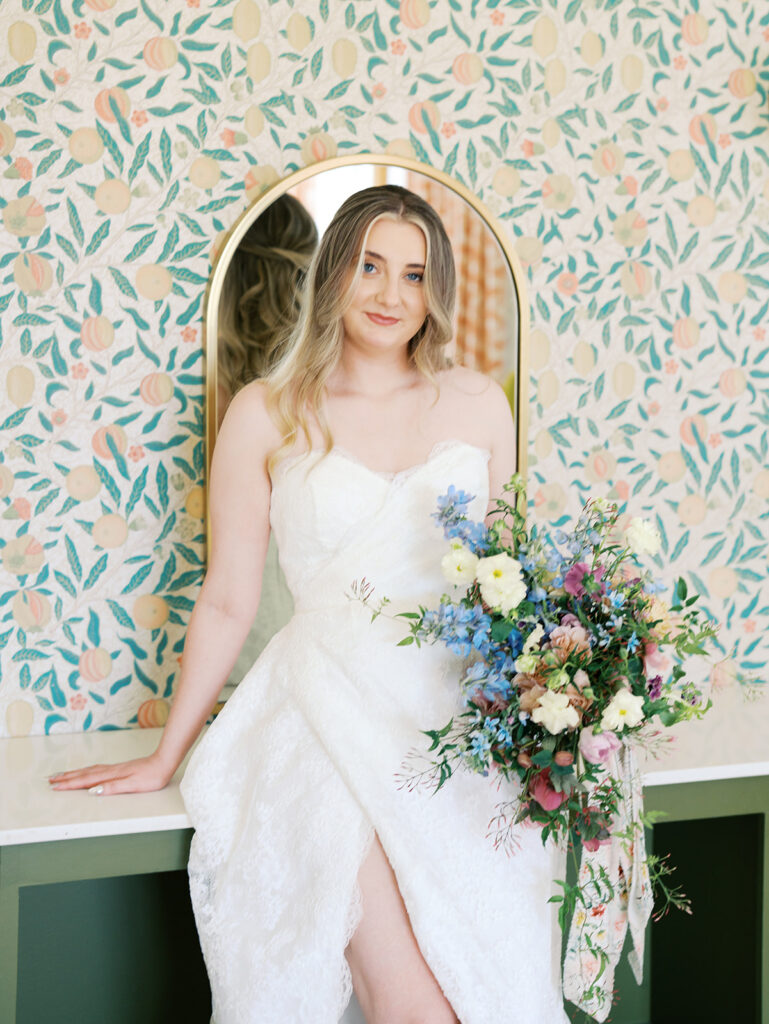 austin wedding florist makes her own bridal bouquet with spring wedding colors and flowers
