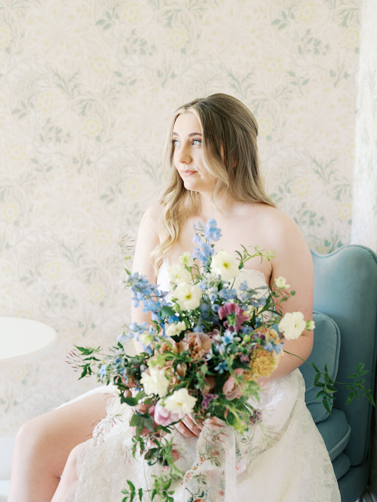 austin wedding florist makes her own bridal bouquet with spring wedding colors and flowers