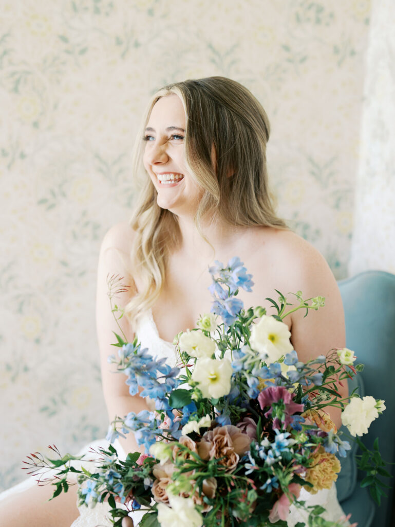 austin wedding florist makes her own bridal bouquet with spring wedding colors and flowers