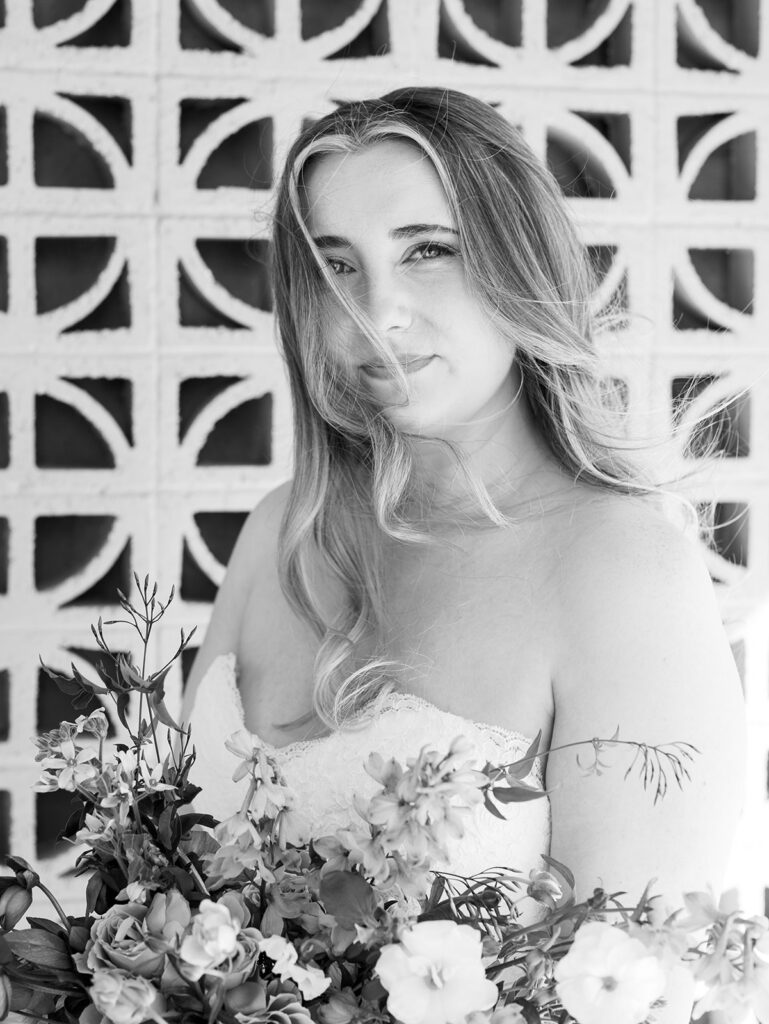 austin wedding florist makes her own bridal bouquet with spring wedding colors and flowers