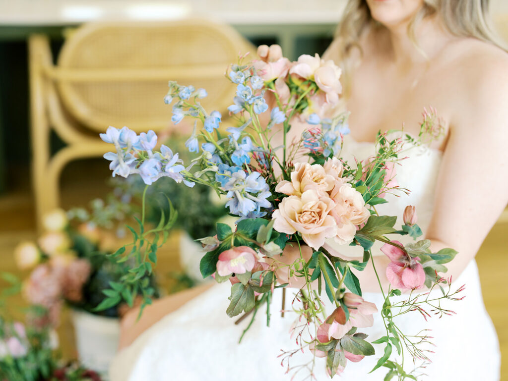 indoor bridal portraits at an austin wedding venue with bright spring florals