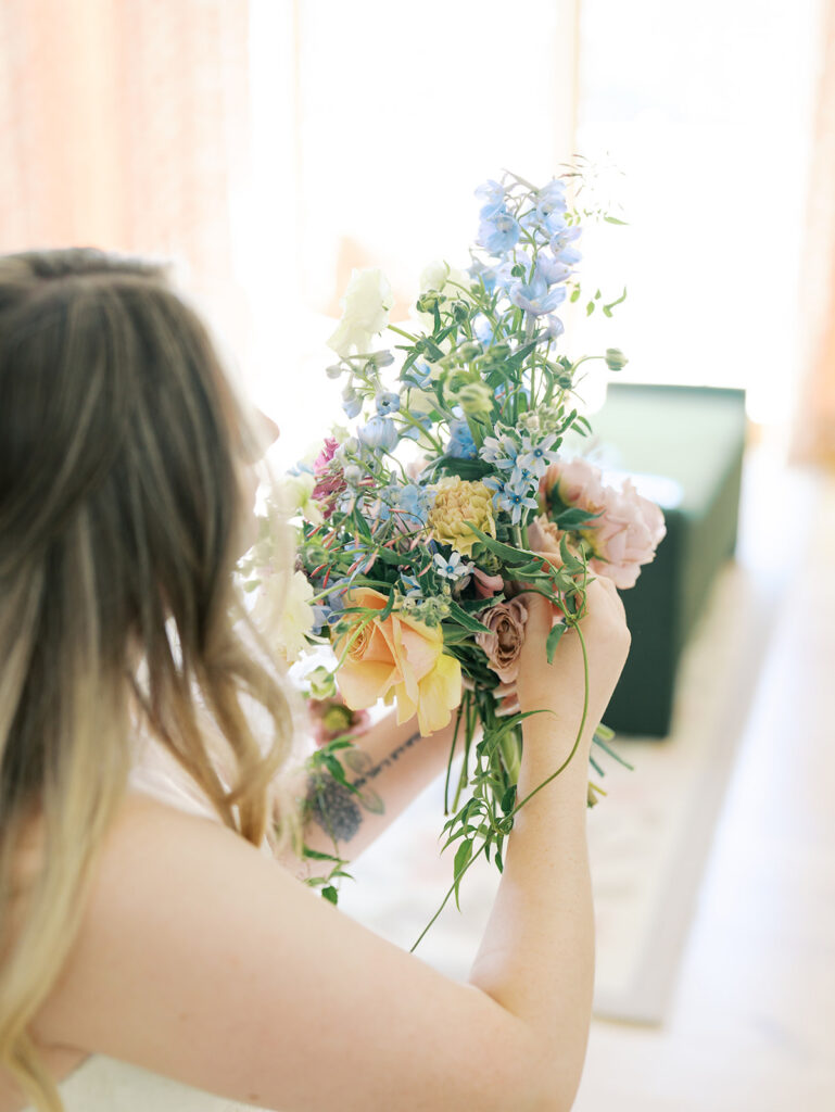 indoor bridal portraits at an austin wedding venue with bright spring florals