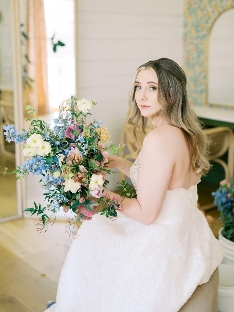 indoor bridal portraits at an austin wedding venue with bright spring florals