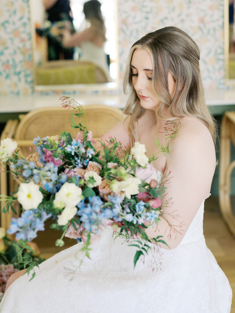 austin wedding florist makes her own bridal bouquet with spring wedding colors and flowers