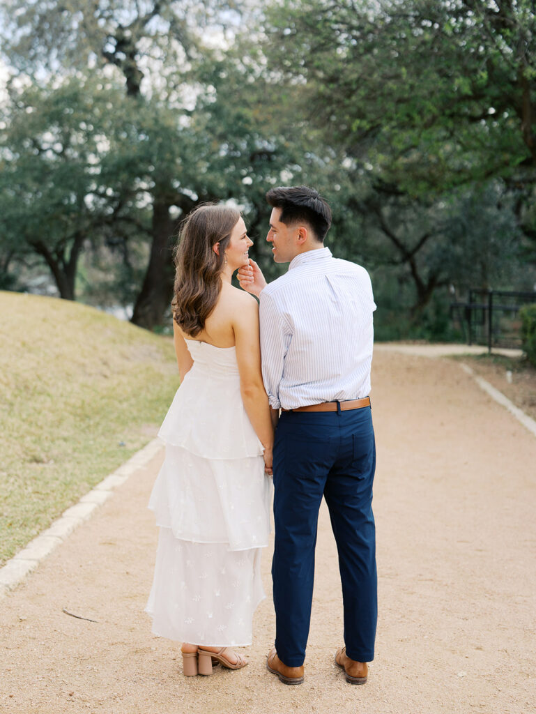 couples photoshoot outfits white engagement dress and white dress shirt