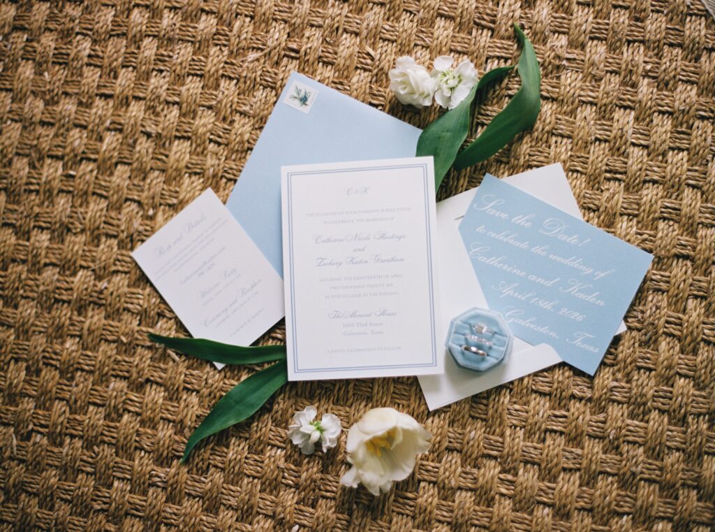 wedding flatlay details on wicker backdrop 