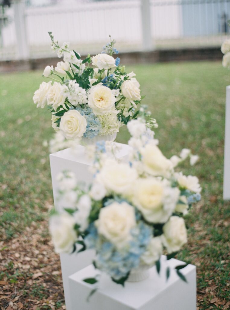 wedding day floral arrangements in blue and white 