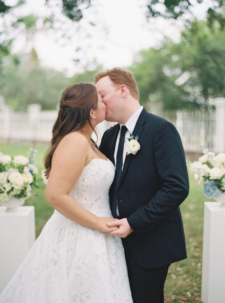bride and groom sharing a kiss on wedding day 