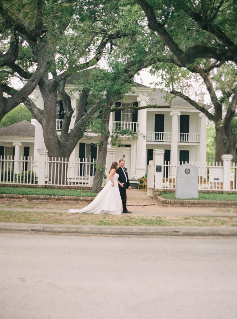 bride and groom walking together and smiling 