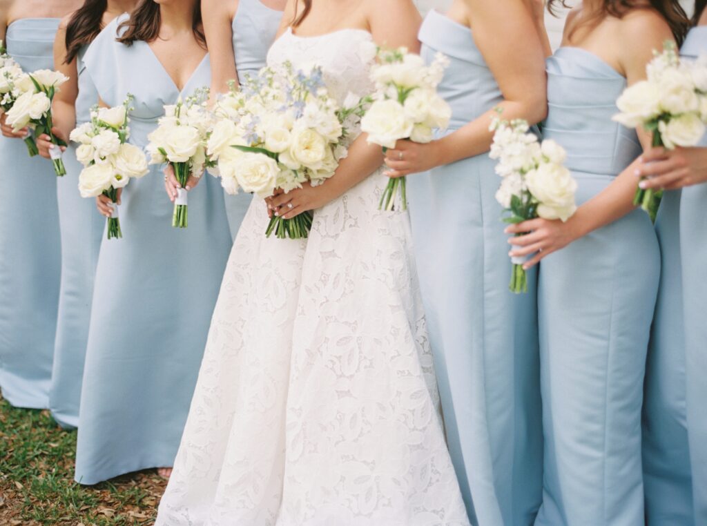 detail photo of bride and her bridesmaids showing white and blue color scheme 