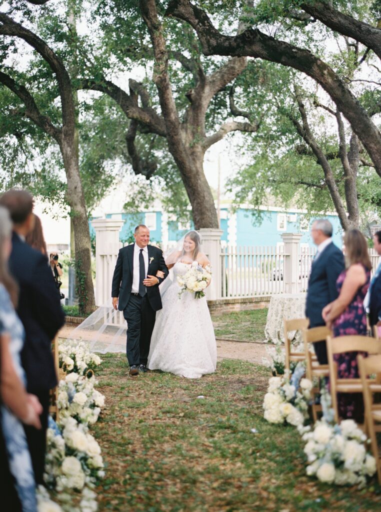 bride being walked down aisle 