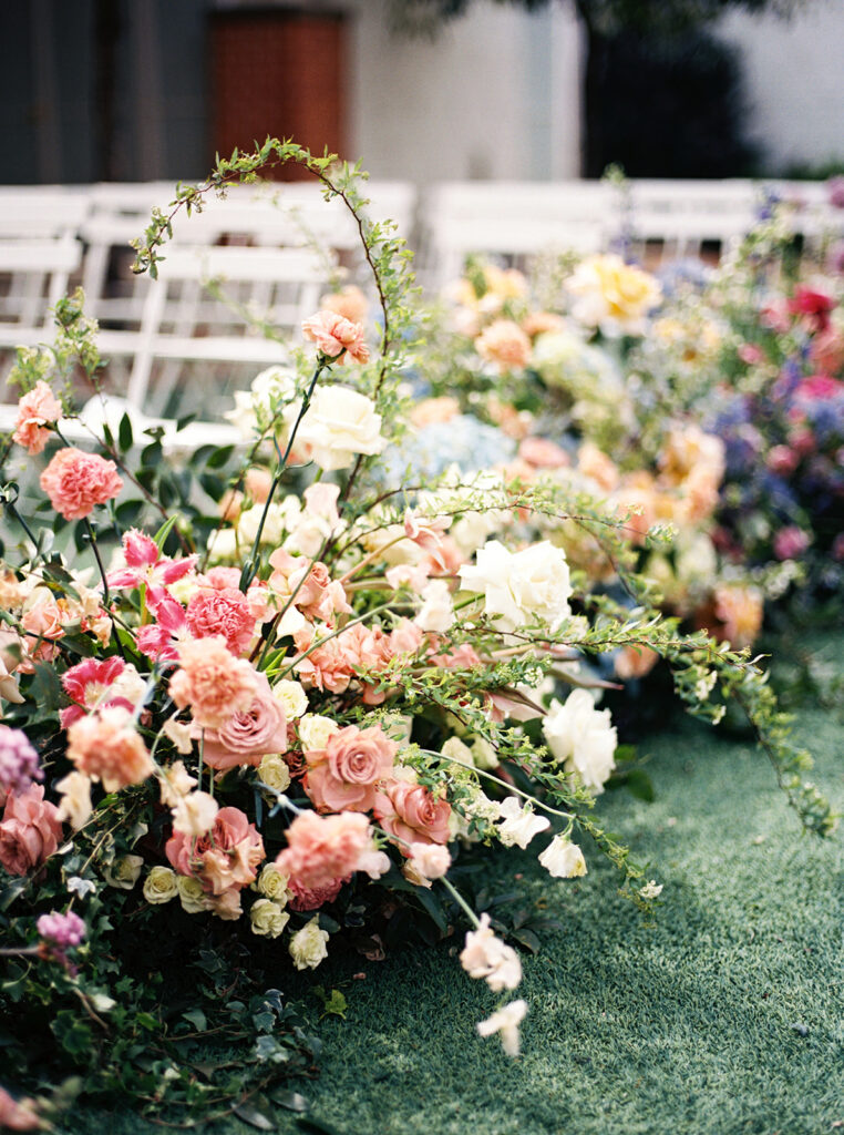 film wedding photography of wedding aisle flowers for a spring garden wedding in austin