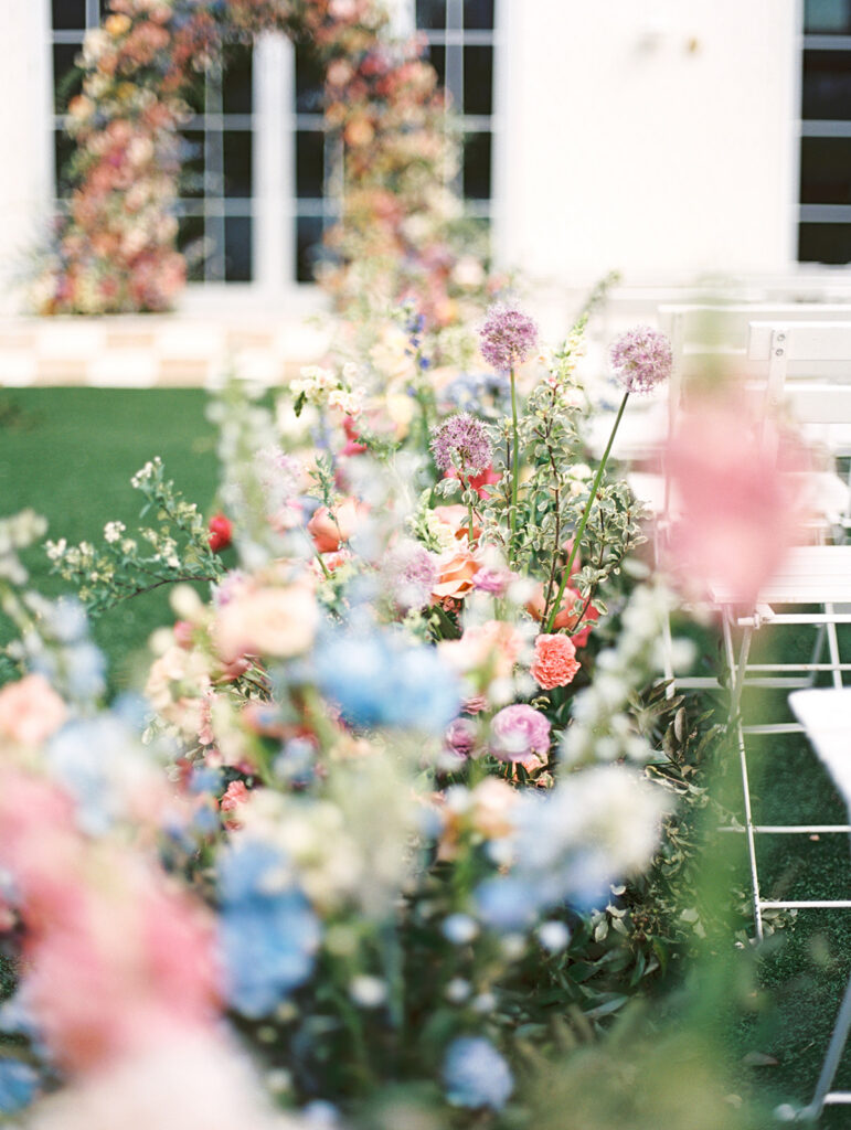 film wedding photography of wedding aisle flowers for a spring garden wedding in austin
