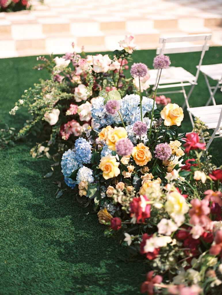 film wedding photography of wedding aisle flowers for a spring garden wedding in austin